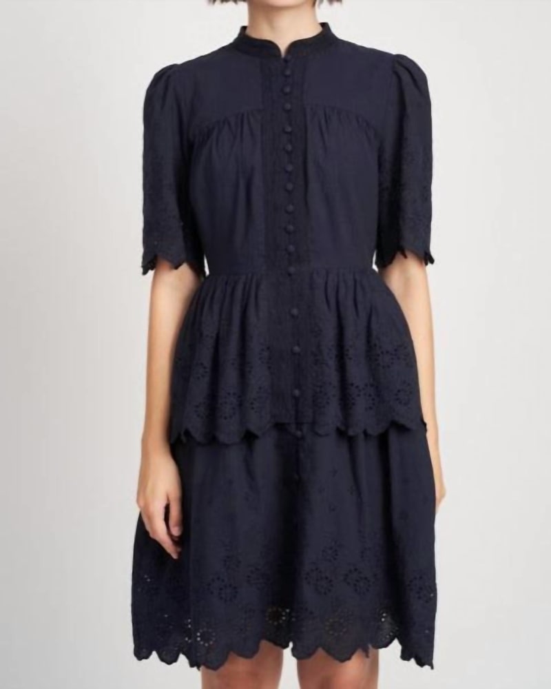 Front of a model wearing a size L Marin Mini Dress in Black in Black by En Saison. | dia_product_style_image_id:335443